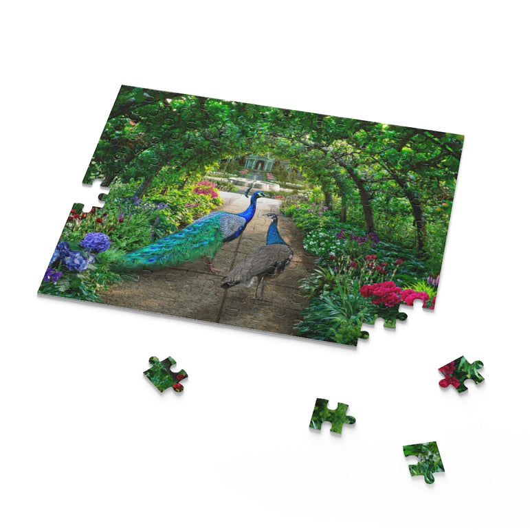 Peacocks walks through a green garden full of irises and hydrangeas - Jigsaw Puzzle