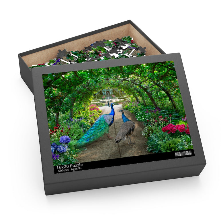 Peacocks walks through a green garden full of irises and hydrangeas - Jigsaw Puzzle