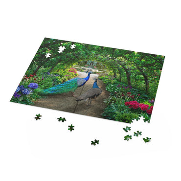 Peacocks walks through a green garden full of irises and hydrangeas - Jigsaw Puzzle
